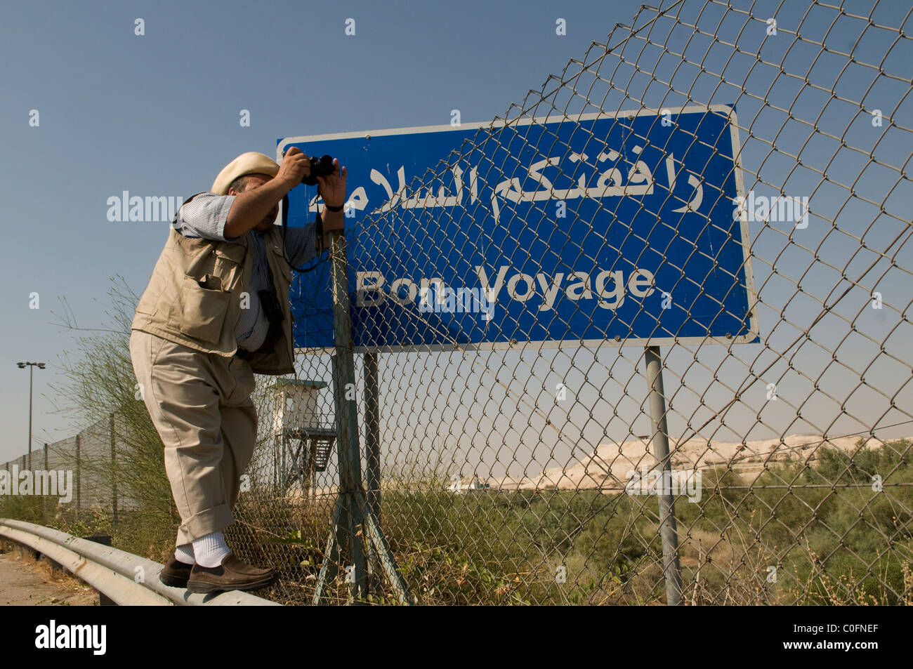 A tourist snapping at Allenby Bridge or King Hussein Bridge crossing point between Israel and Jordan at the Jordan Valley Stock Photo