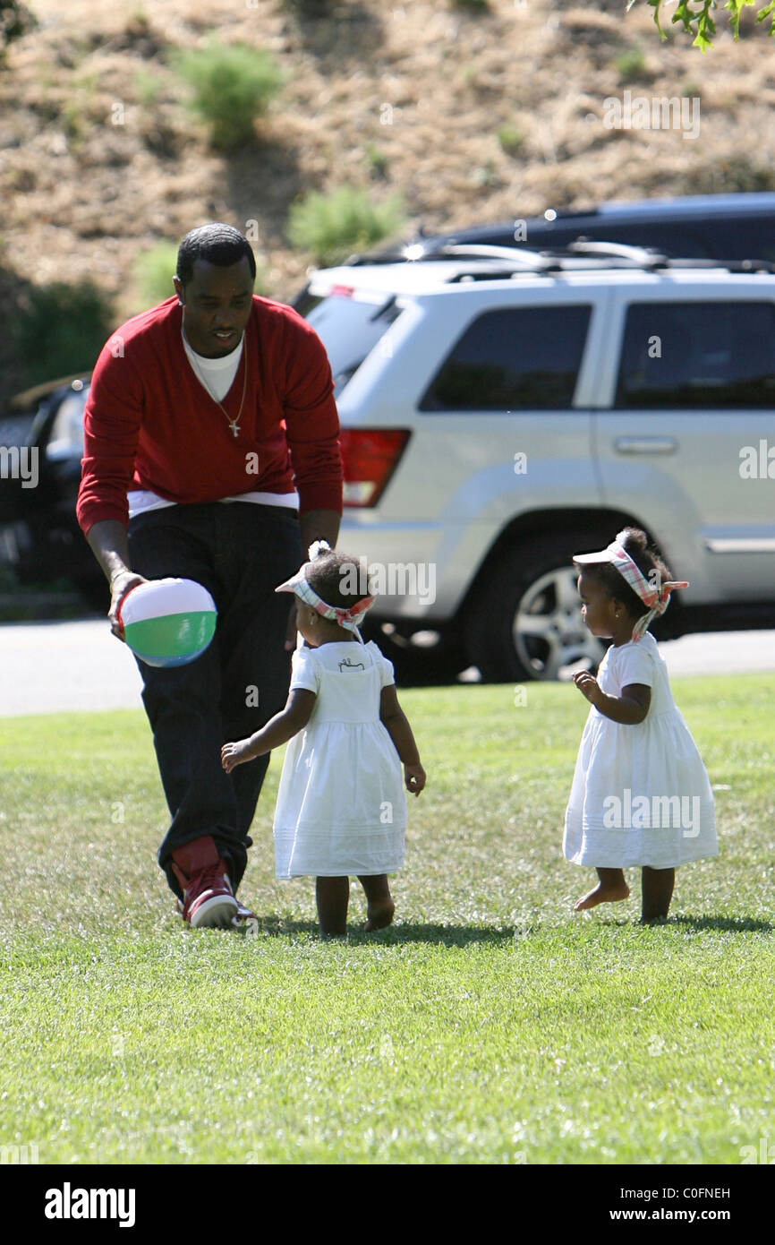 Sean 'P. Diddy' Combs plays with his twin daughters D'Lila Star Combs