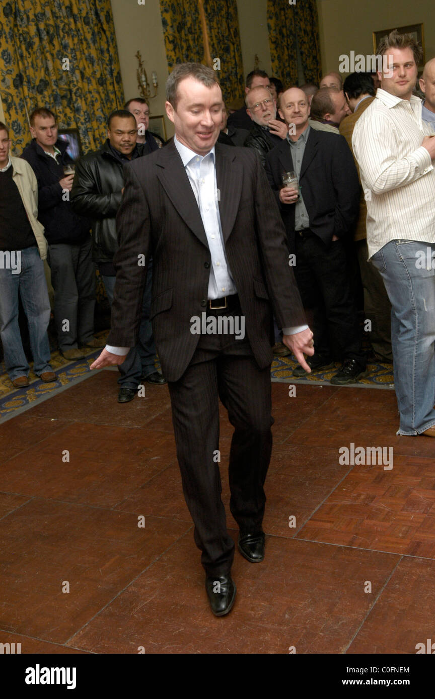 Drinker enjoying himself after a day at Cheltenham Horse races. The Queen Hotel. Stock Photo