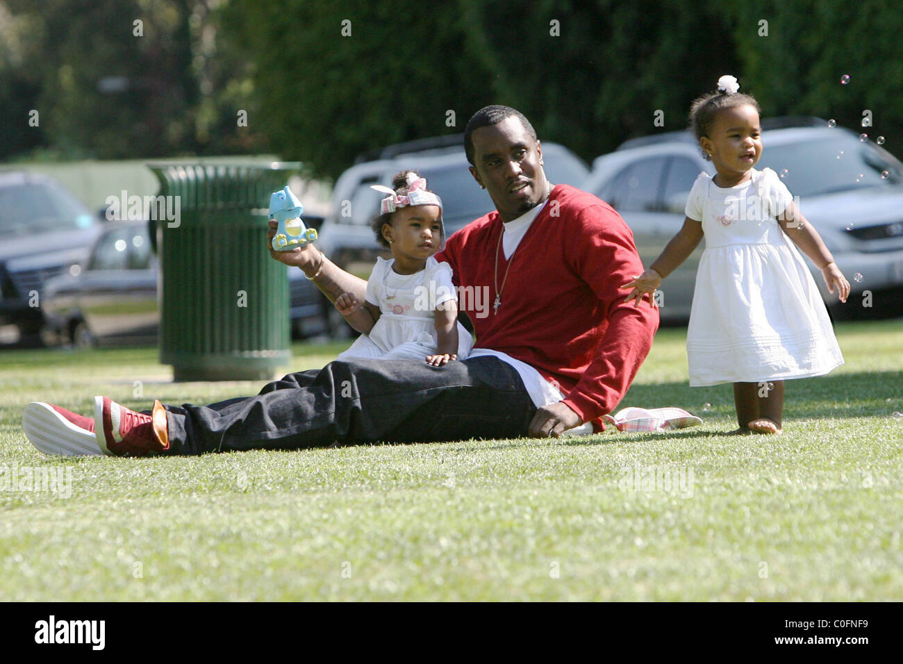 Sean 'P. Diddy' Combs plays with his twin daughters D'Lila Star Combs