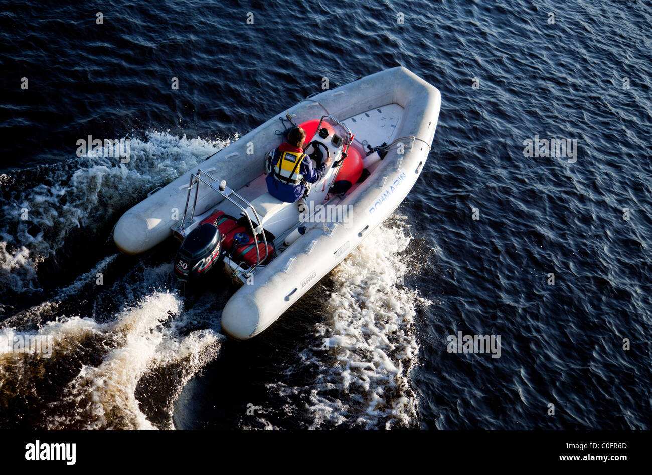 Aerial view of man driving Brig rigid inflatable boat / skiff ( RHIB , RIB ) , Finland Stock Photo