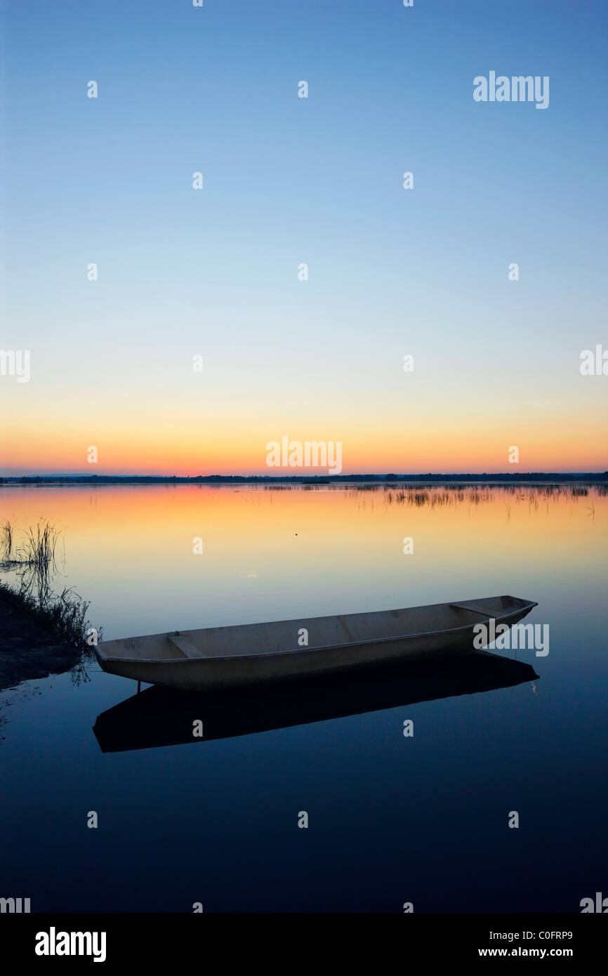 Fishing boat at sunset. Stock Photo