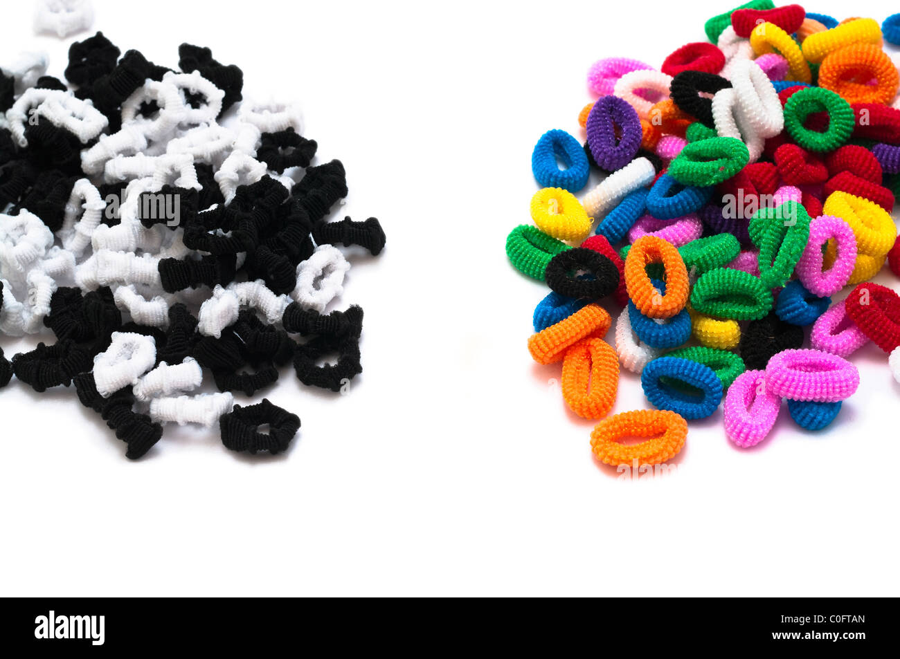 Stack blackandwhite and color hair binders opposite and two against