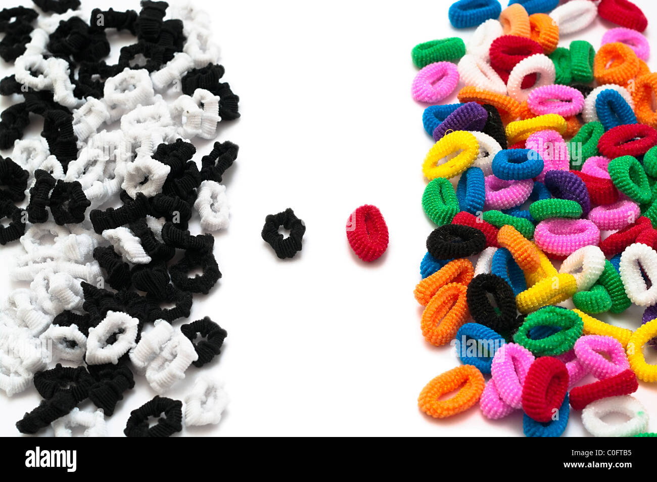 Stack blackandwhite and color hair binders opposite and two against