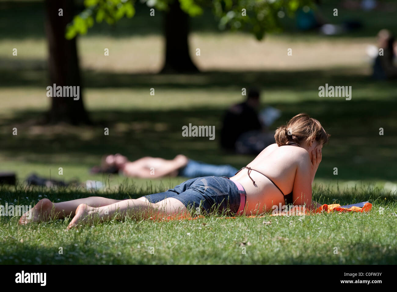 Young woman enjoying the sun in St.James's Park, London, England, UK. Stock Photo