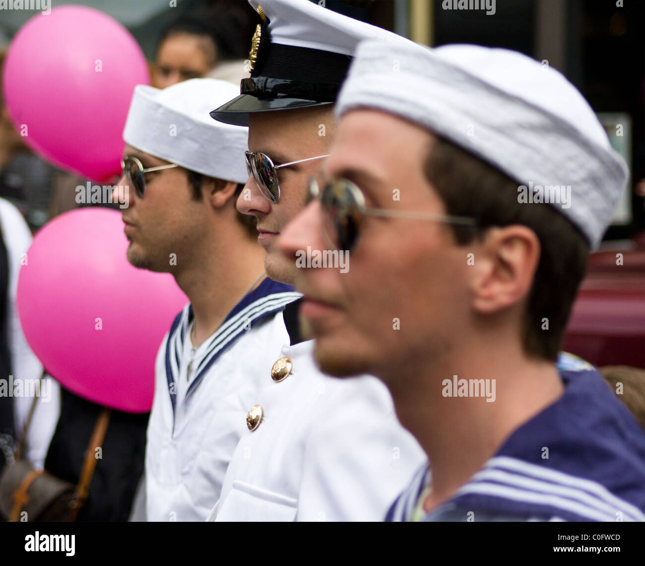 Men dressed as sailors at a Gay Pride parade in downtown Reykjavik, Iceland. Stock Photo