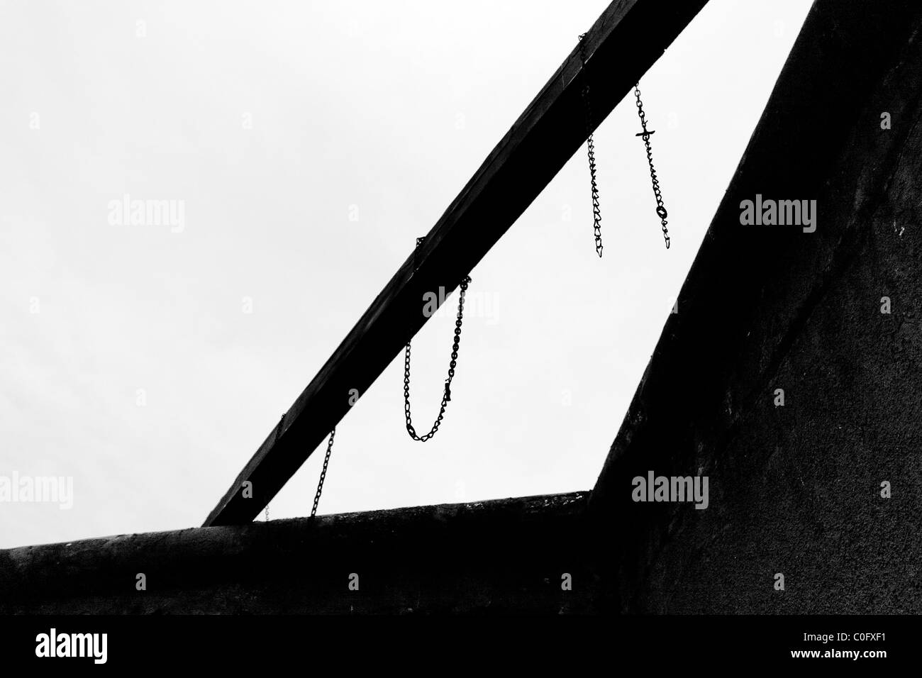 Chains of death. Execution area and chains used in hanging at the Fort Breendonk, a former Nazi concentration camp in Belgium. Stock Photo