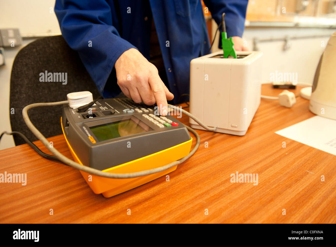 PAT testing an electrical appliance, UK Stock Photo