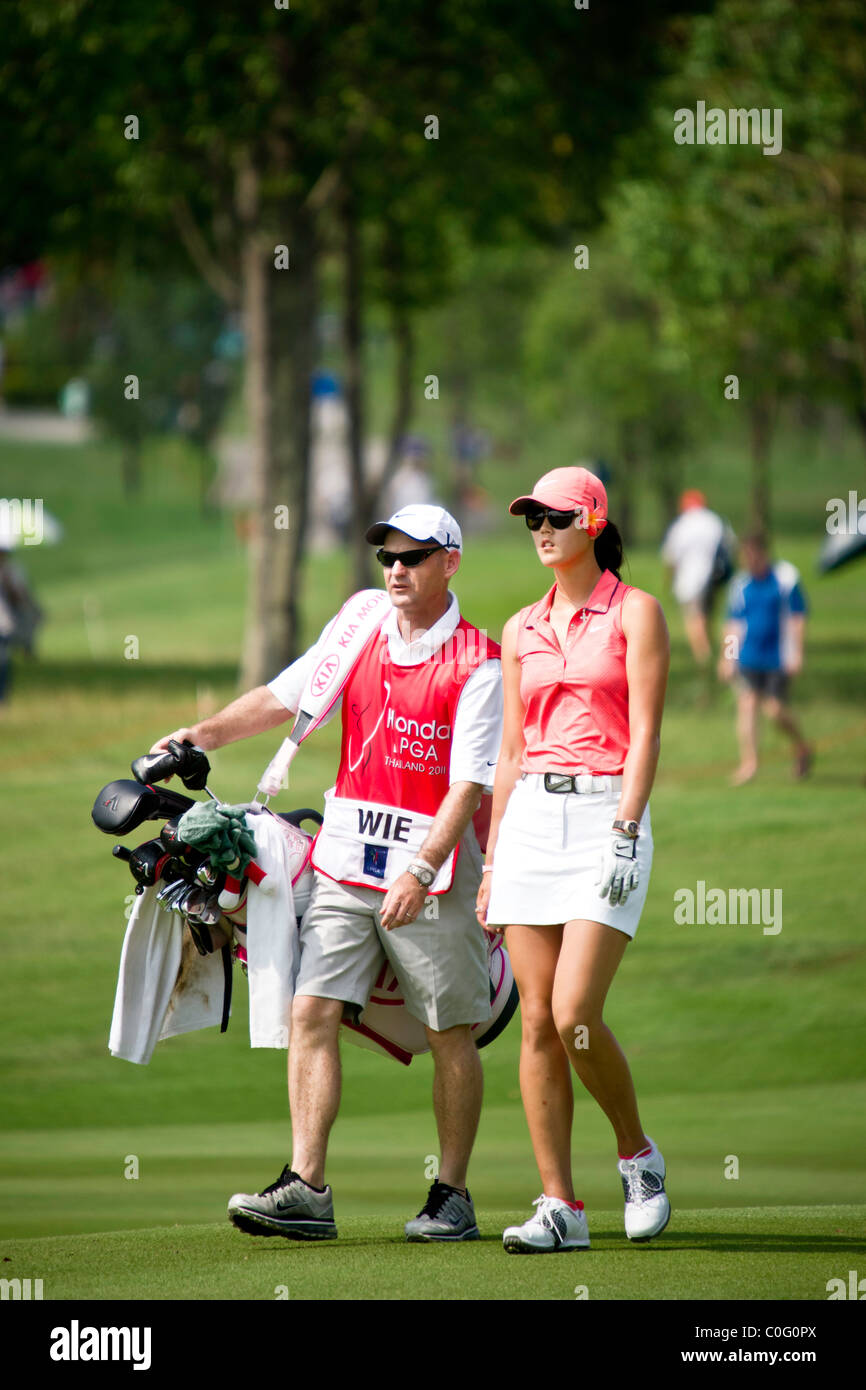 Michelle Wie (USA) walks towards hole 10 with her caddy during the final day of Honda LPGA in Thailand Stock Photo