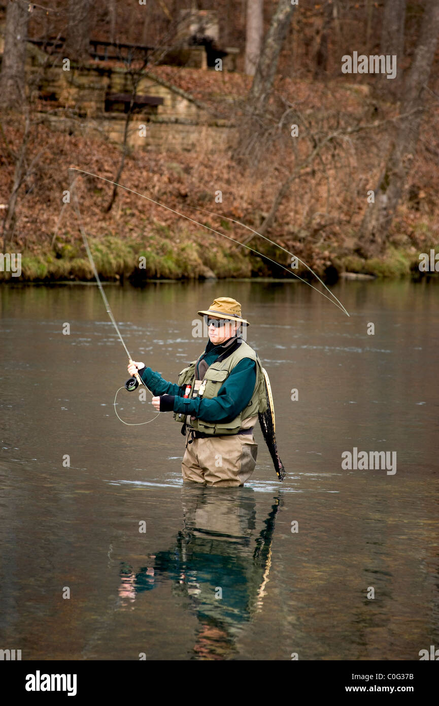Winter fly fishing for trout Stock Photo Alamy
