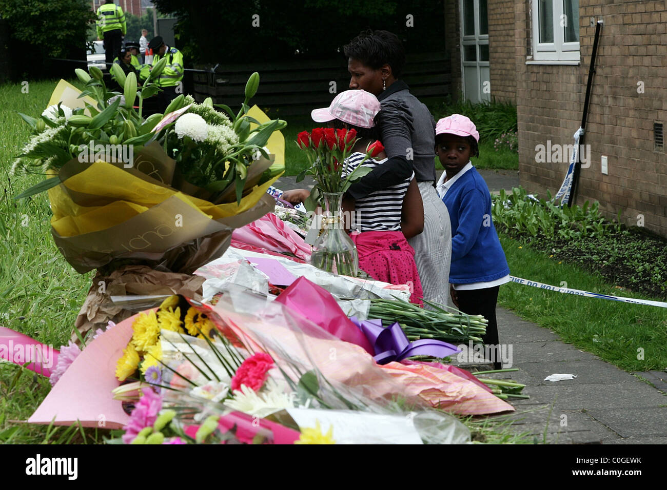 A memorial of flowers at the crime scene of the murdered Pat Regan. Prominant anti-gun campaigner Pat Regan was found stabbed Stock Photo