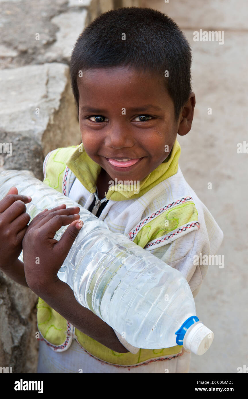 Indian boy carrying water bottle hi-res stock photography and images - Alamy