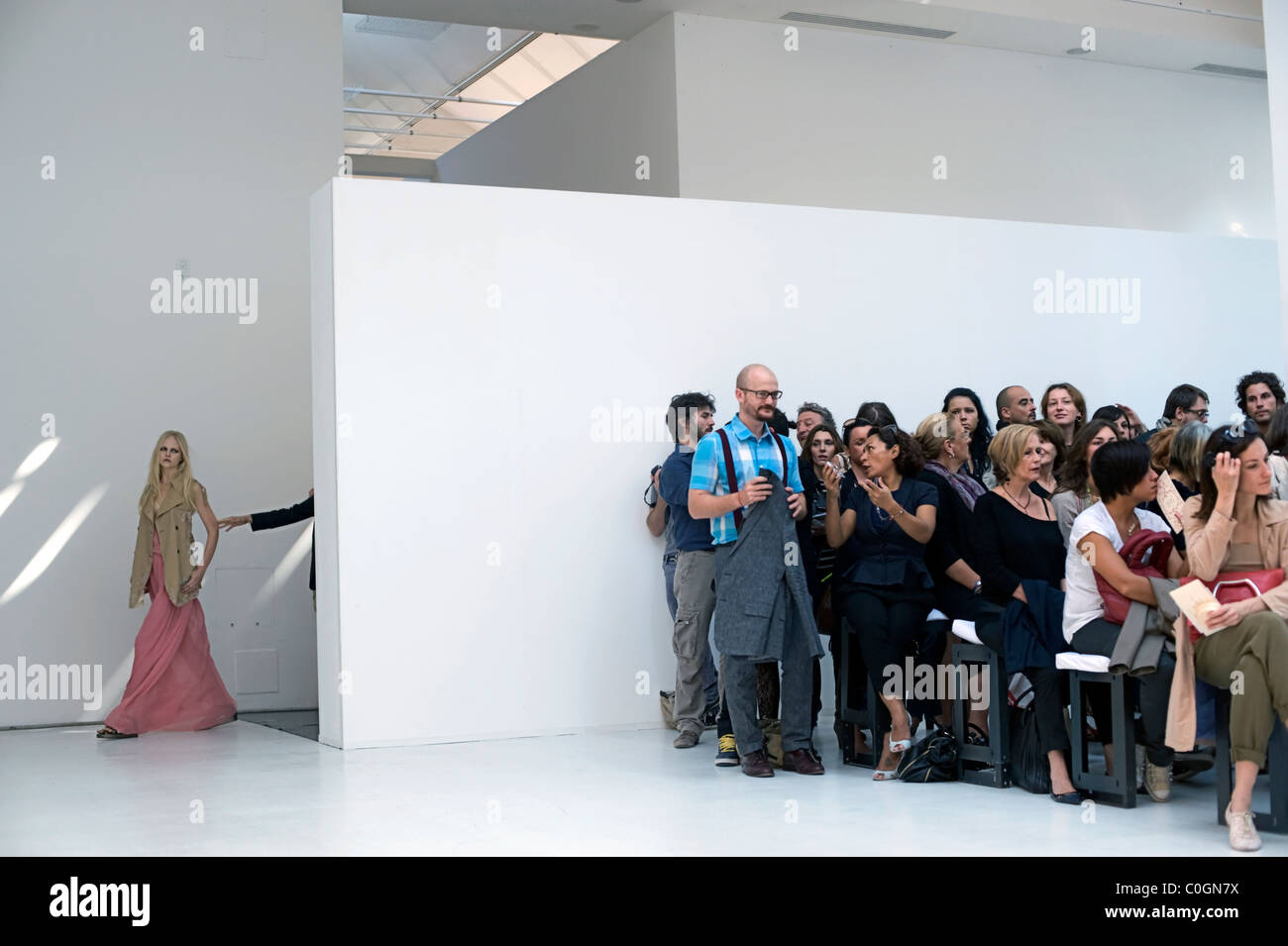 model going onto catwalk at fashion in milan, italy Stock Photo