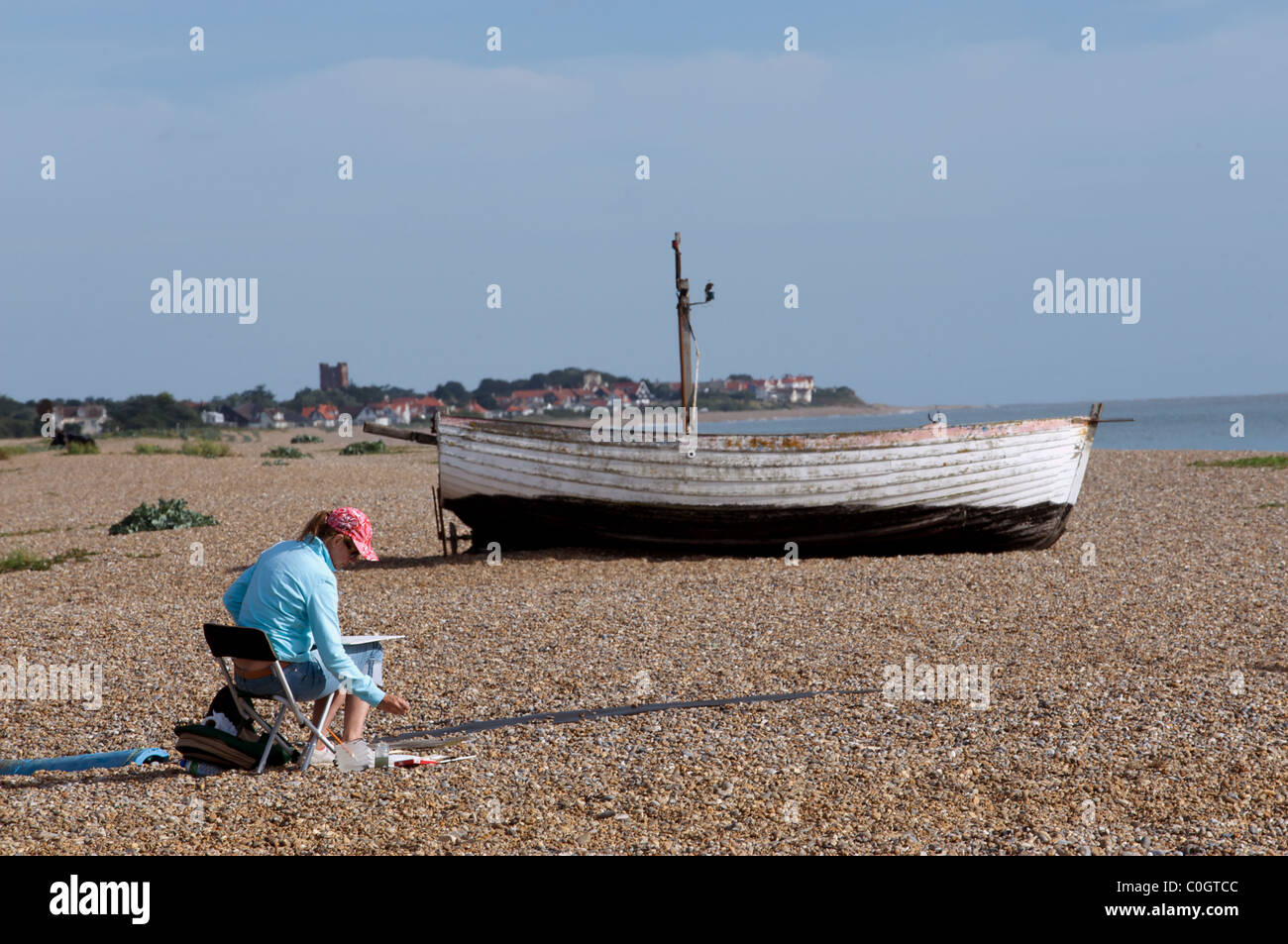 Artist painting beach scene, Aldeburgh, Suffolk, UK. Stock Photo
