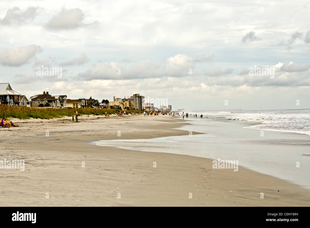Ocean beach  with waves with a cloudy sky in Jacksonville Beach, Florida, USA Stock Photo