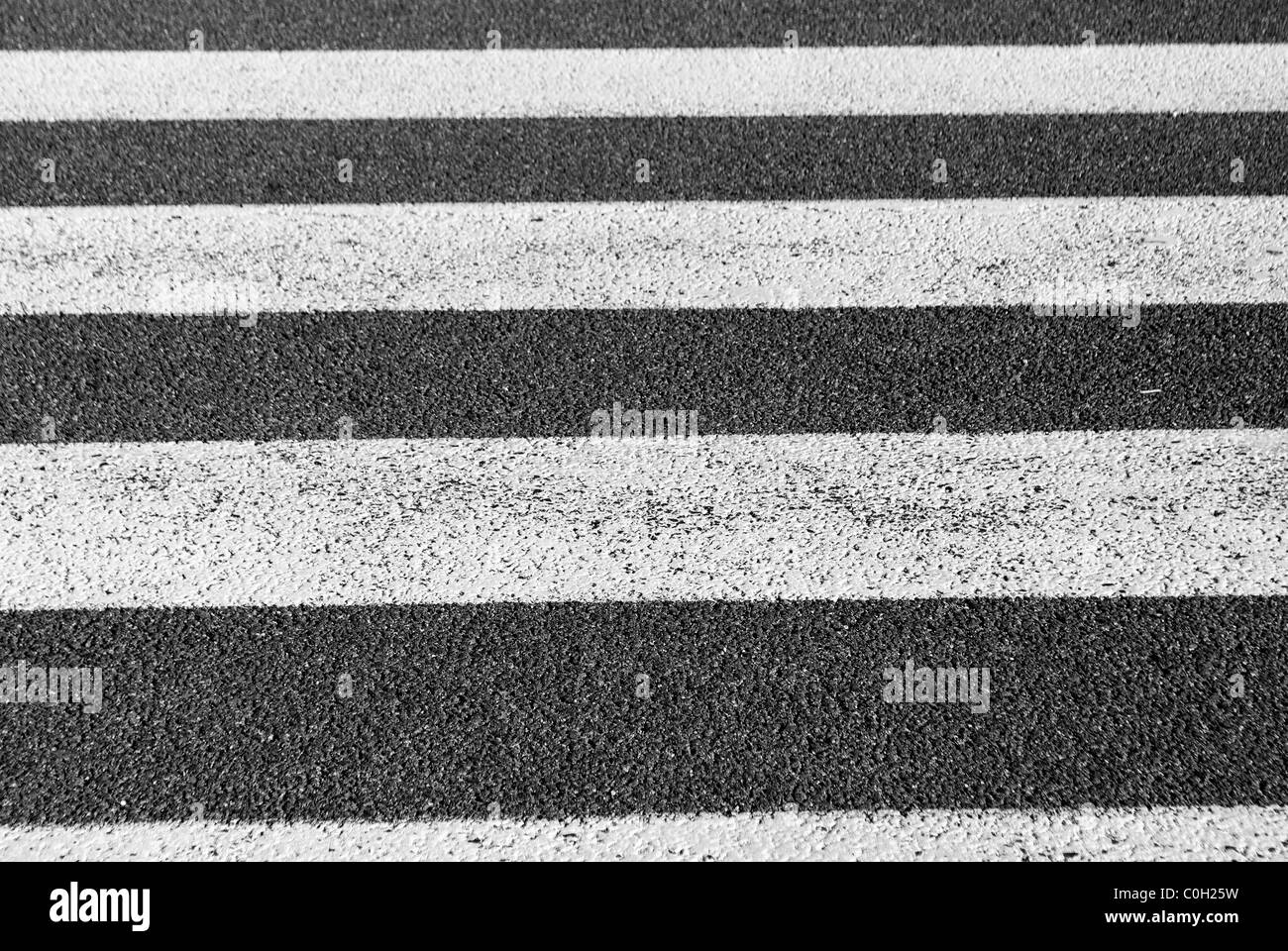 crosswalks, white on black asphalt Stock Photo