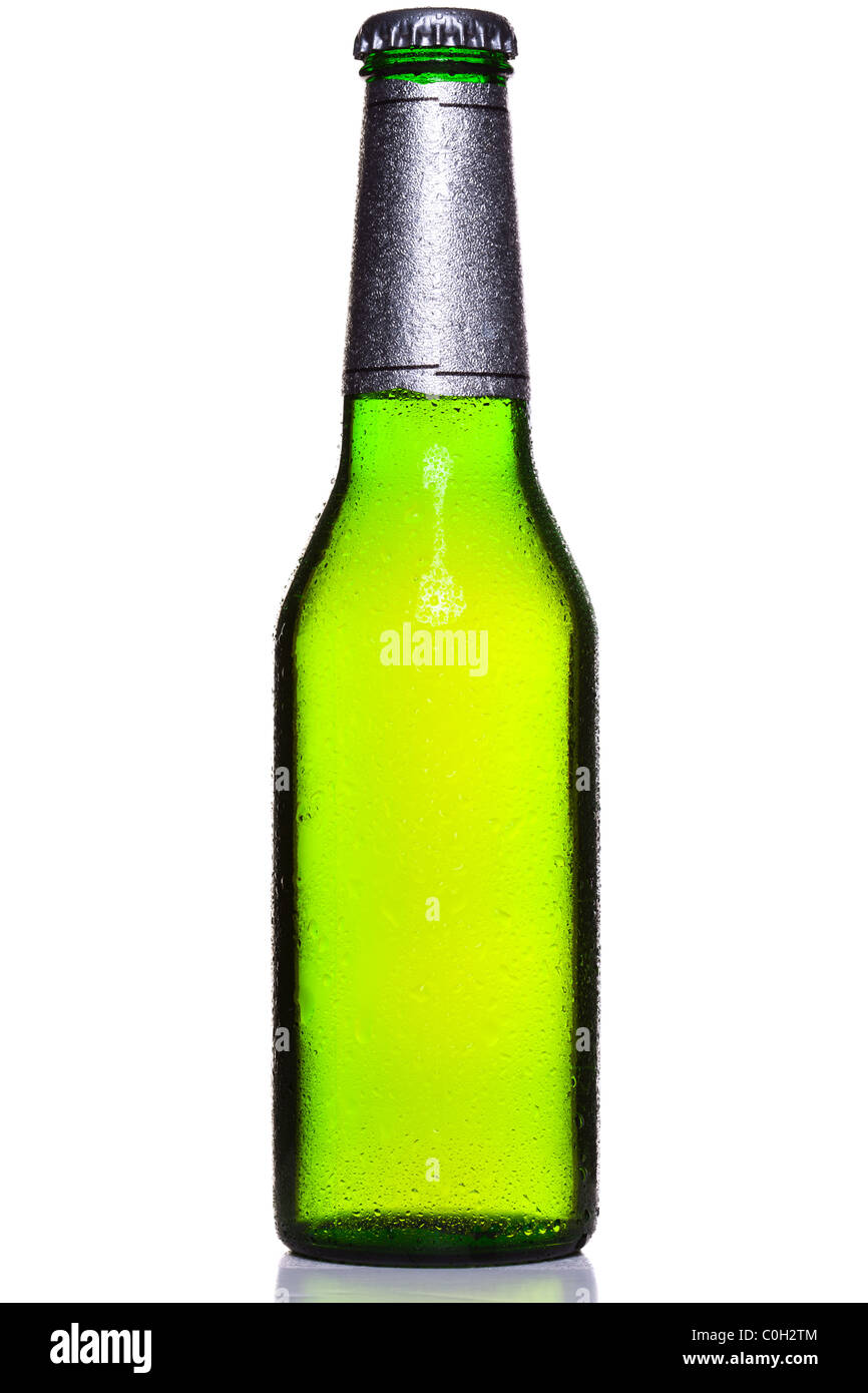 Photo of an ice cold bottle of beer covered in droplets with foil wrapper and cap, isolated on a white background. Stock Photo