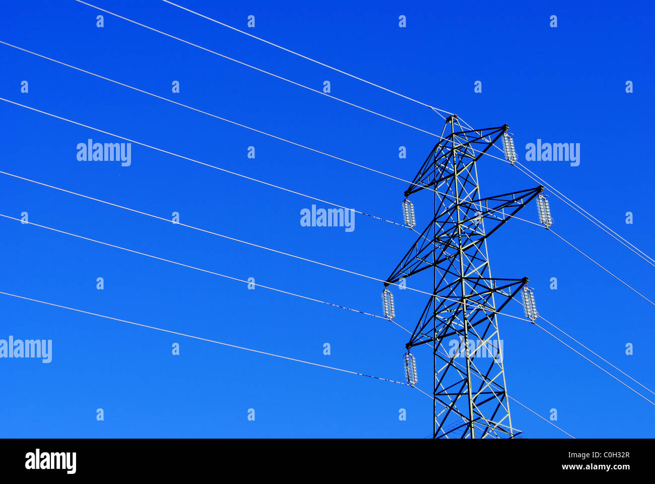 pylon high voltage power transmission lines Stock Photo - Alamy