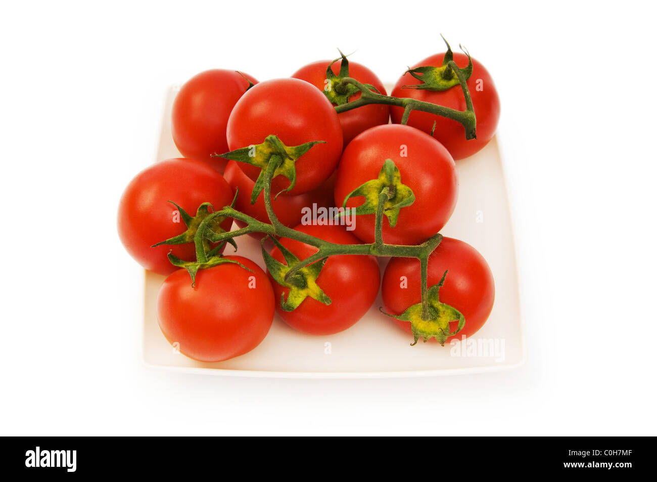 Red tomatoes isolated on the white background Stock Photo - Alamy