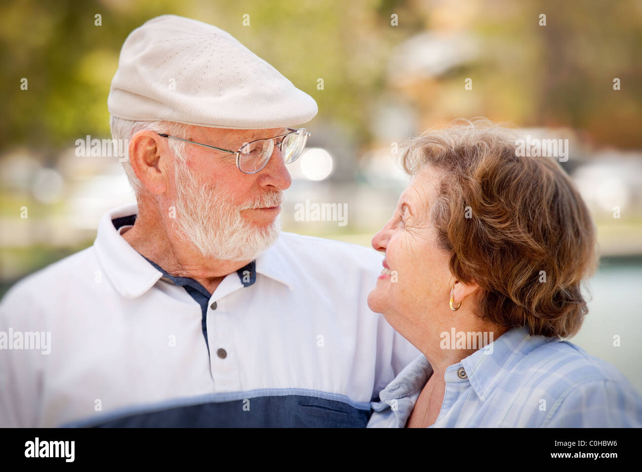 Happy Senior Couple Enjoying Each Other in The Park Stock Photo - Alamy