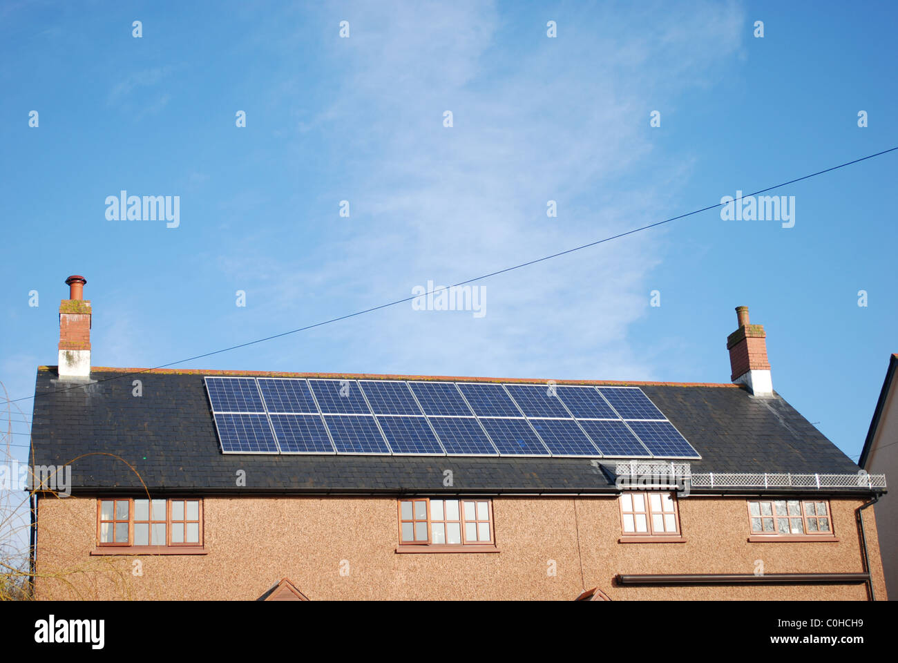 Solar panels on the roof of a UK home. Stock Photo