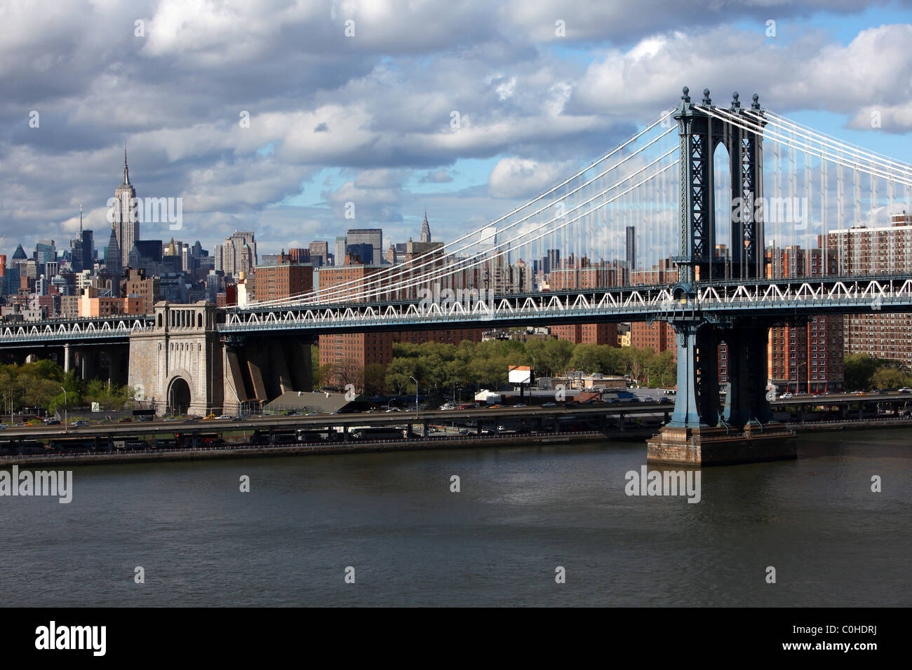 New York city skyline with focus on Manhattan Bridge over the East ...