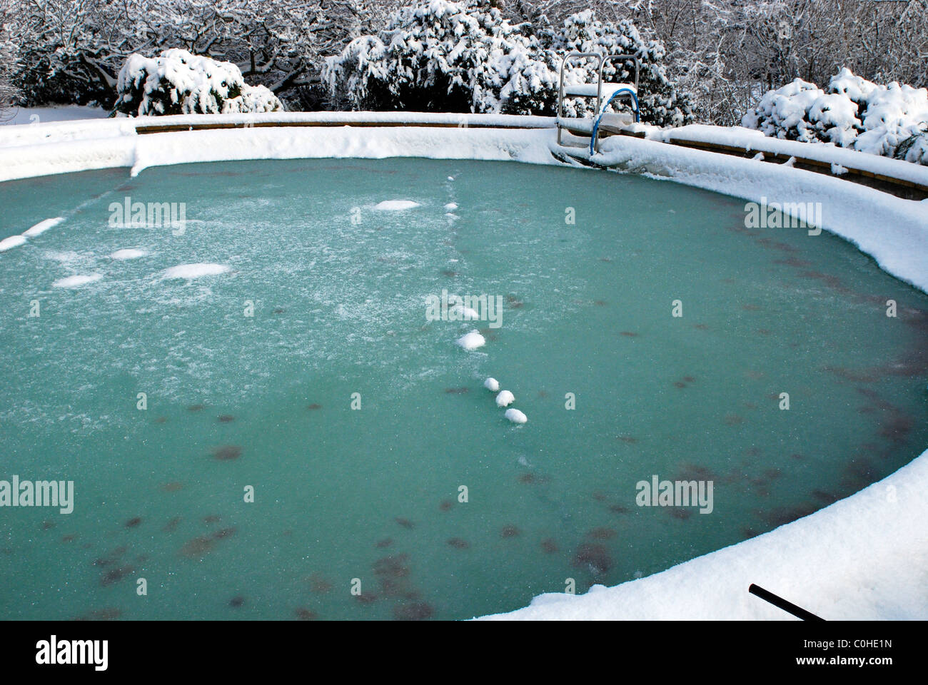 a frozen outdoor swimming pool in winter UK Stock Photo