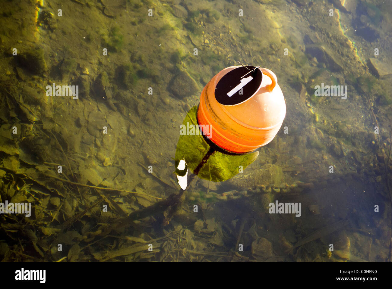 mirror lake with small boat rowing Stock Photo Alamy