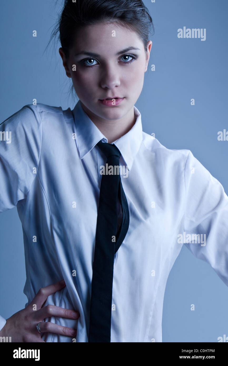 Shot of a Beautiful Teenage Girl in White Shite and Black Tie Stock Photo