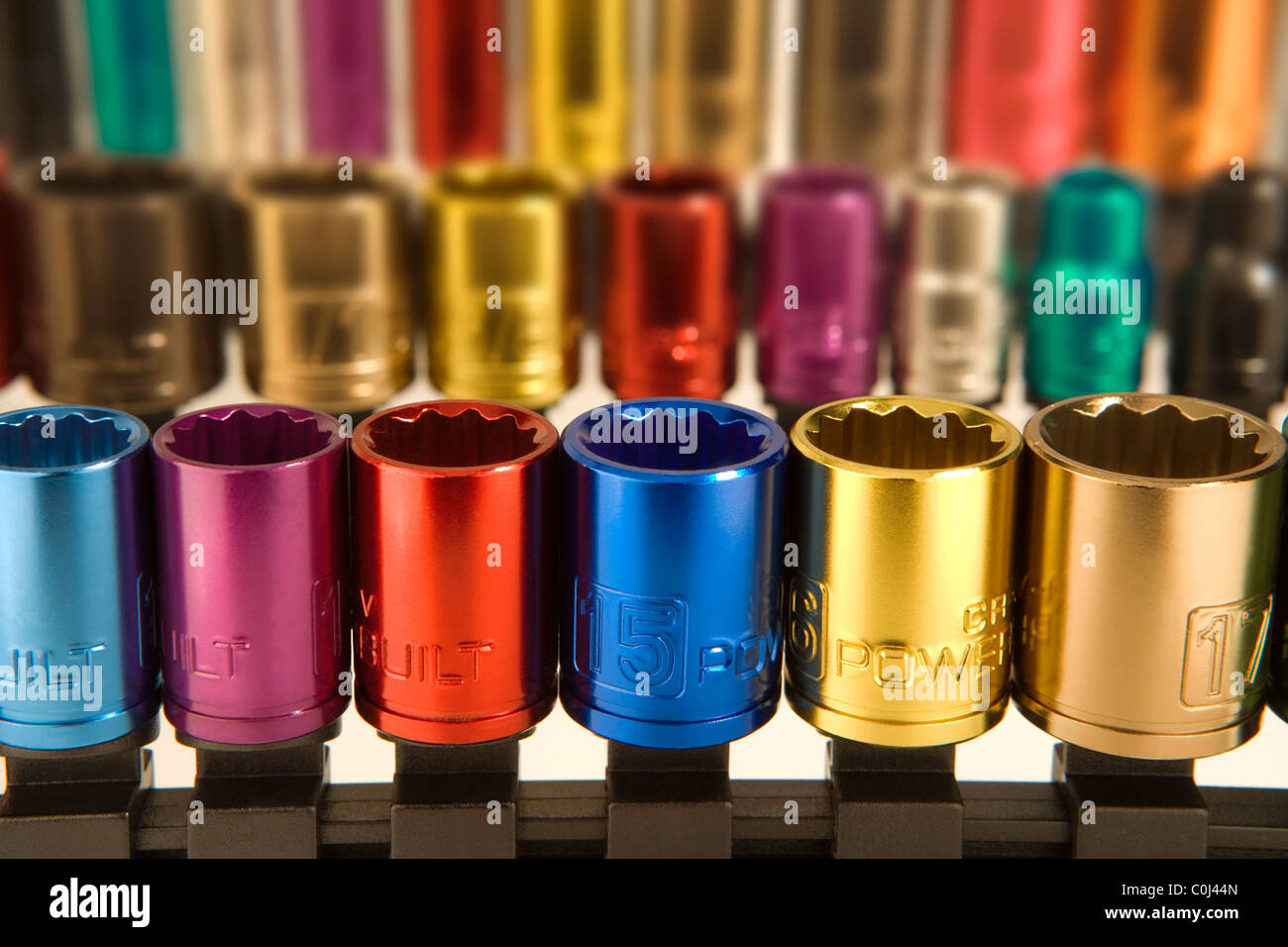 Colored coded metal sockets from a socket wrench set Stock Photo
