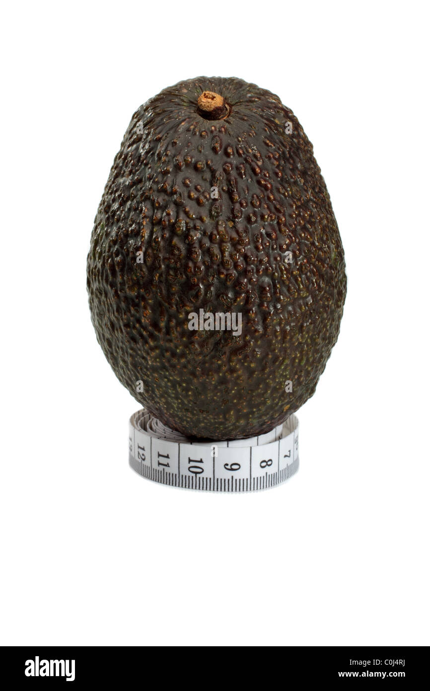 Hass Avocado From Mexico On A Metric Tape measure, Concept For A Healthy Diet Stock Photo