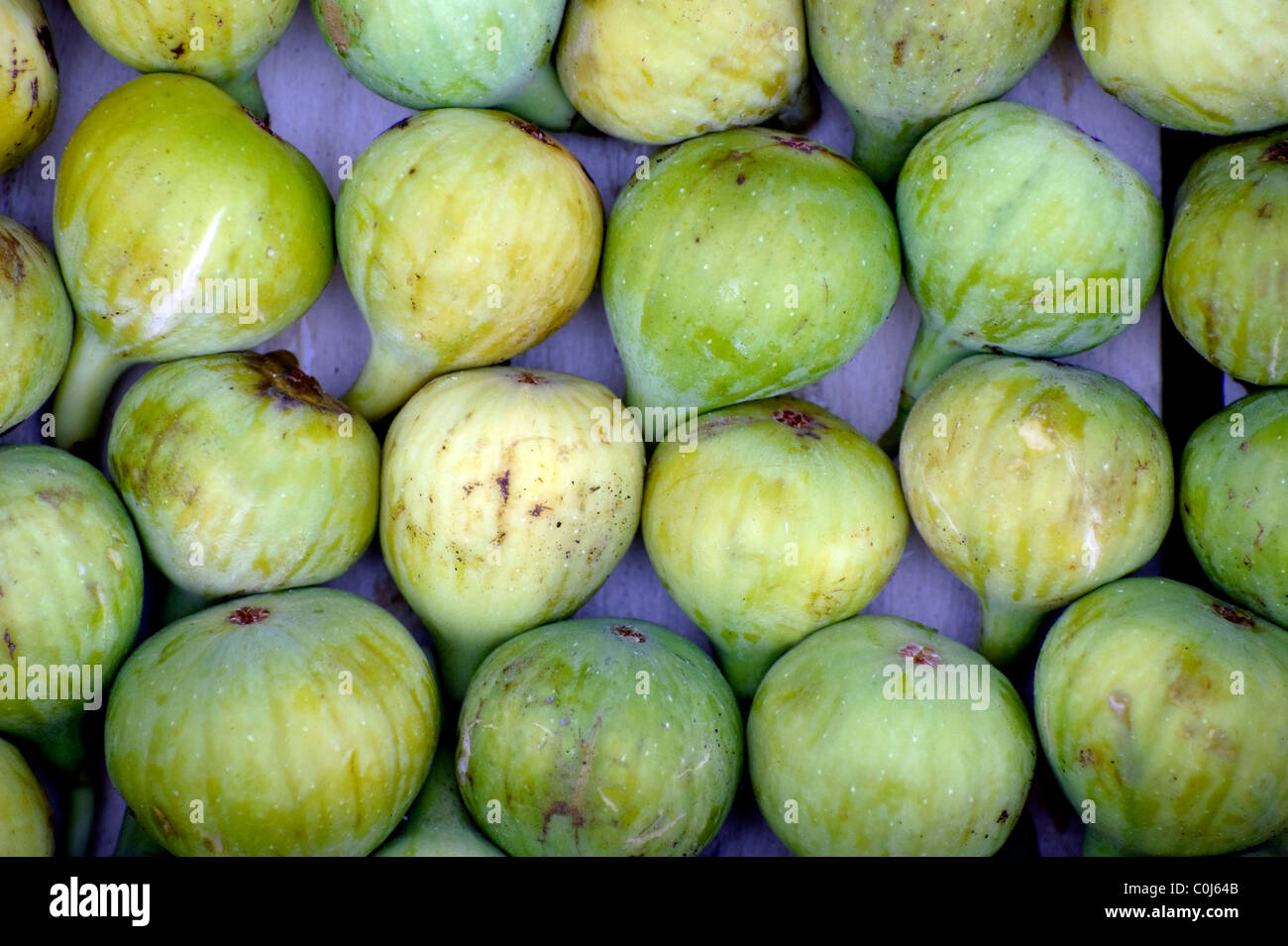 Local grown green figs for sale at a street vegetable and fruit stall market in the small port