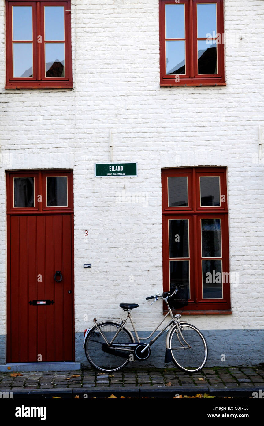 White building and bike Bruges belgium Stock Photo