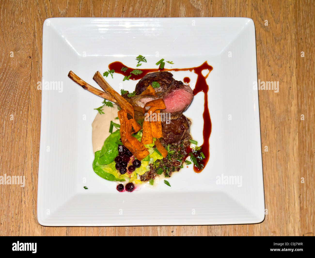 Entree, rack of lamb, served with house made lamb sausage, quinoa and a