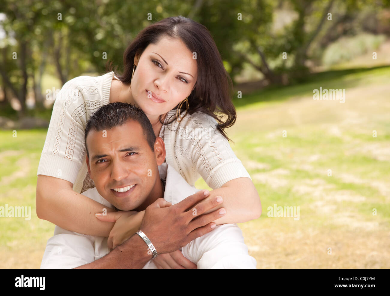 Affectionate Hispanic Couple Portrait in the Park Stock Photo - Alamy