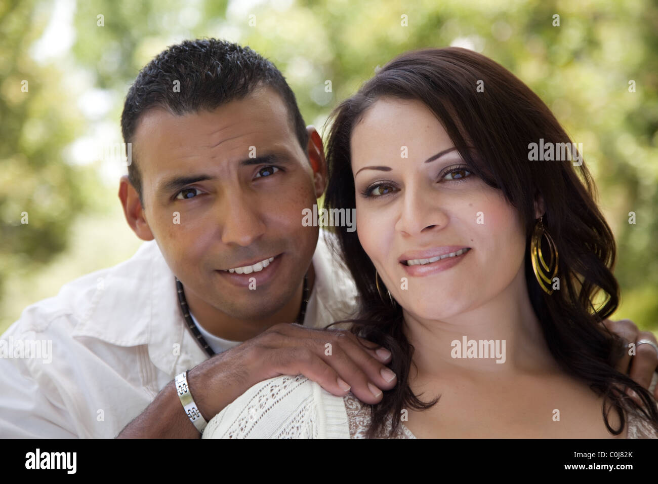 Attractive Hispanic Couple Portrait in the Park Stock Photo Alamy