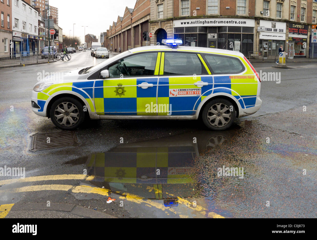 Incident where a Nottinghamshire Police vehicle and officer are in attendance. Diesel spillage was the nature of incident. Stock Photo