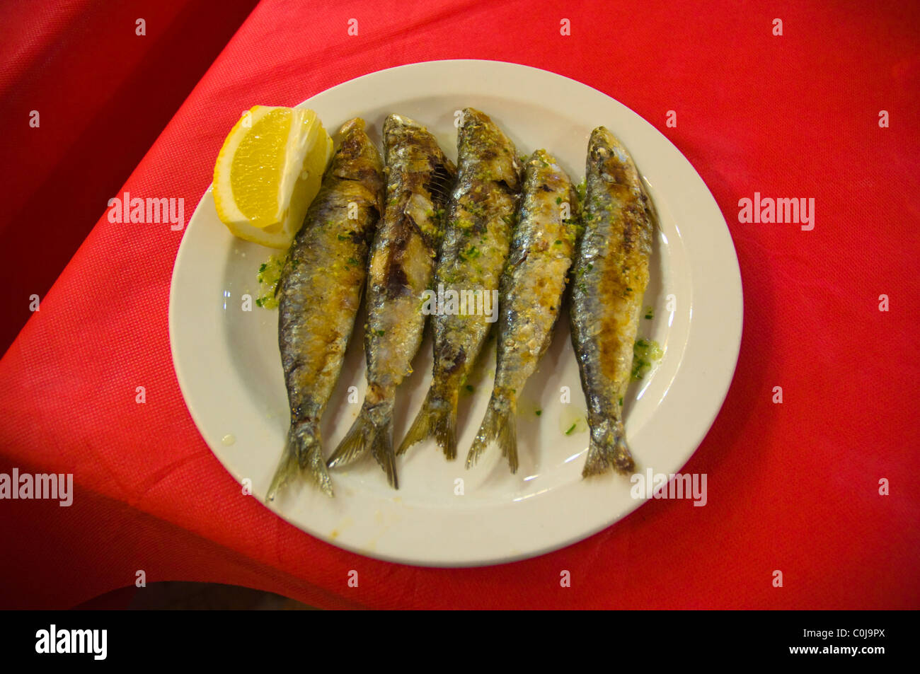 Grilled sardines in restaurant in district Barcelona Catalunya Spain Europe Stock