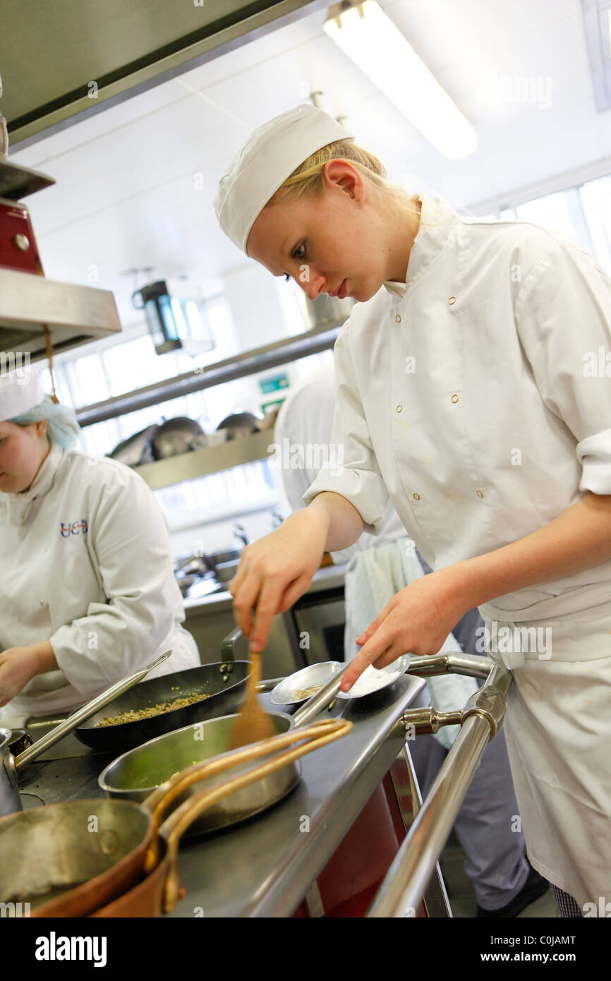 Chefs in a kitchen preparing food at a college for further and higher