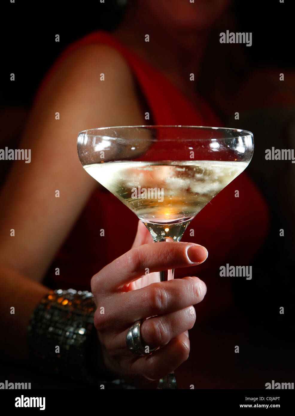 Woman drinking champagne in a city club. Stock Photo