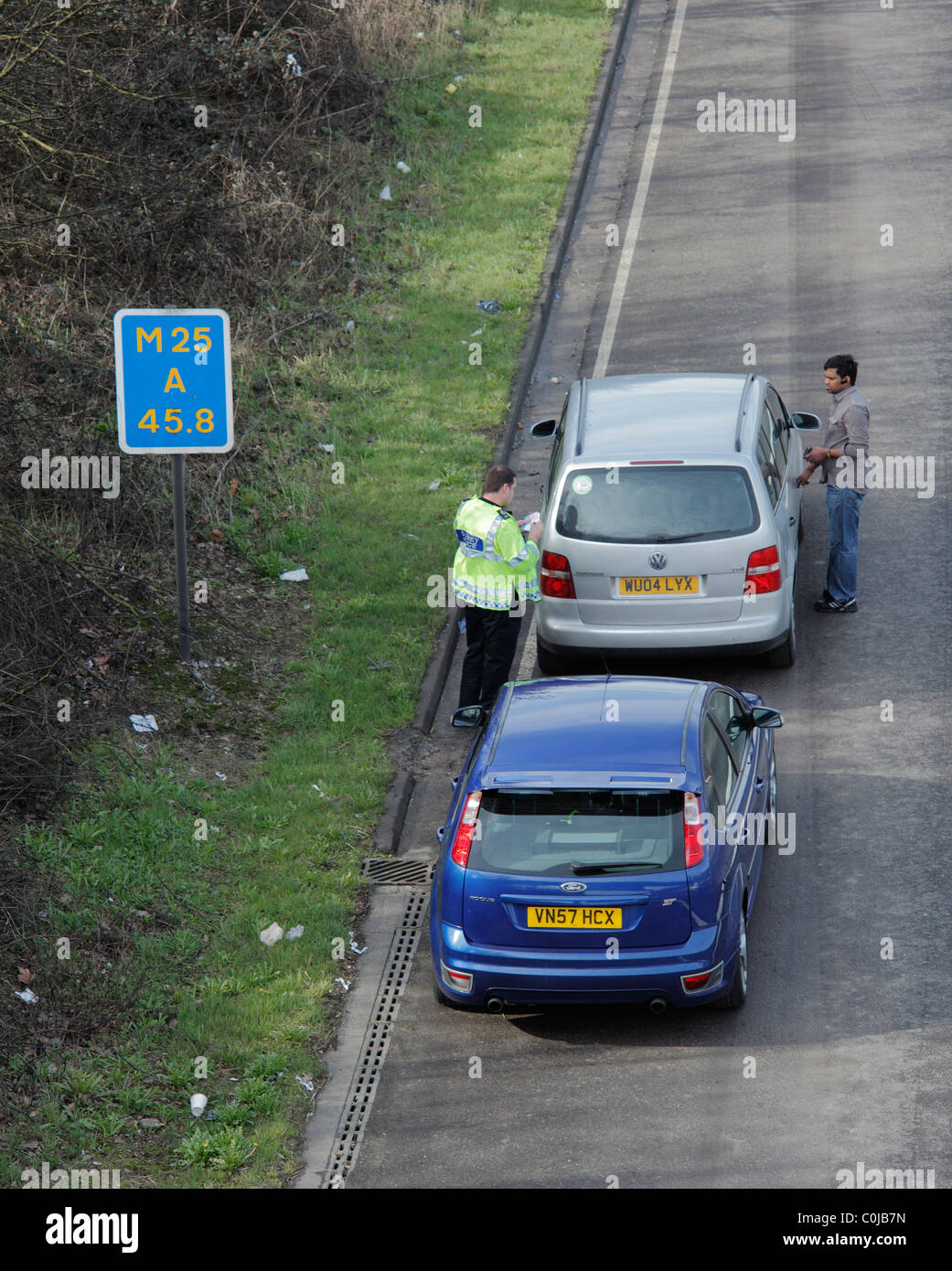 Person receiving a ticket on the M25. Stock Photo
