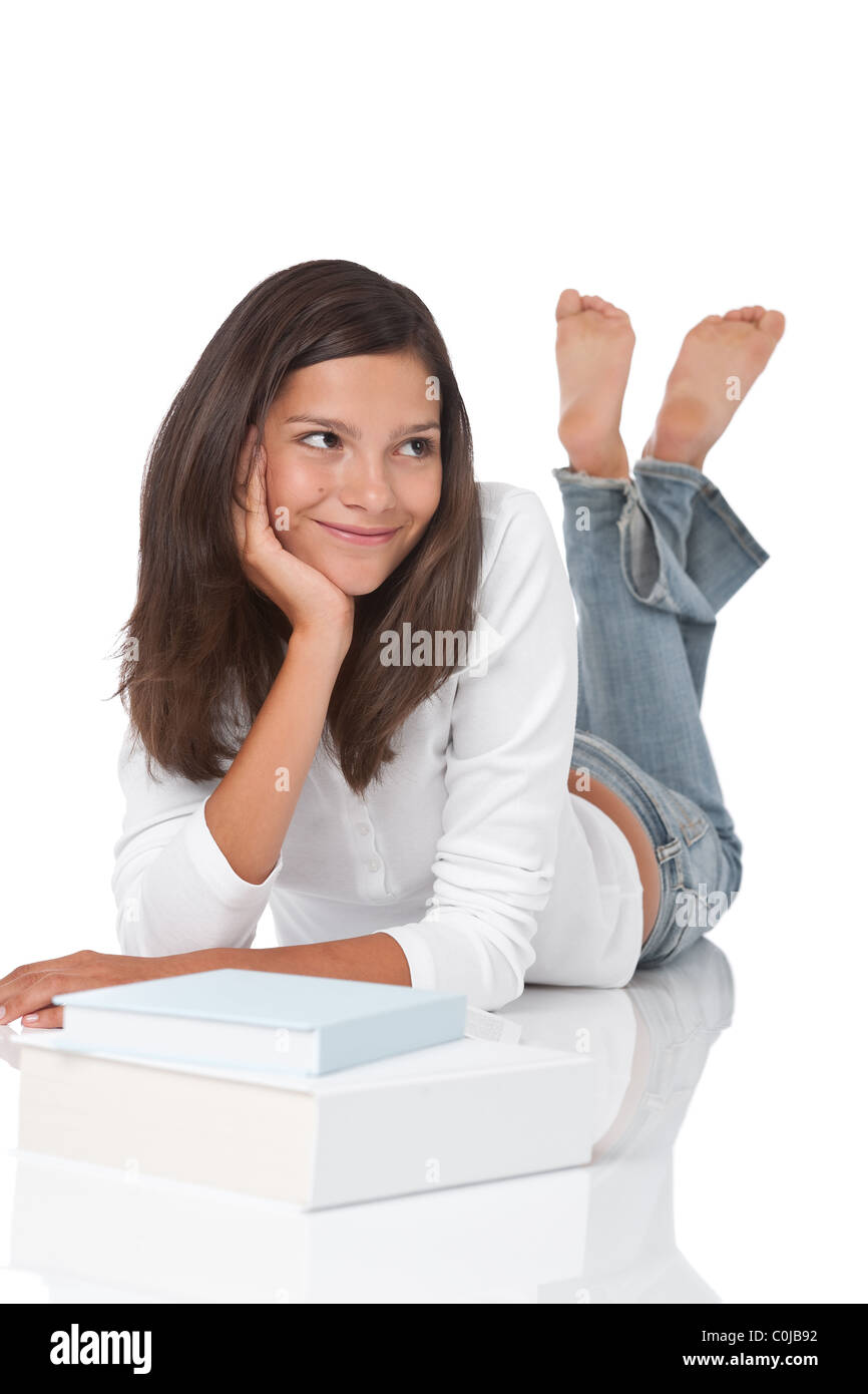 Smiling teenager with books on white background Stock Photo - Alamy