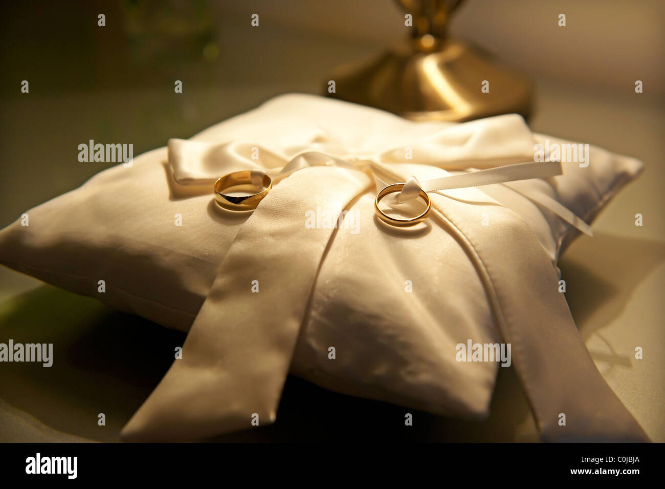 wedding rings on ring cushion Stock Photo Alamy