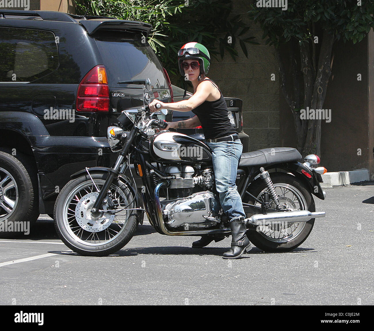 Pink aka Alecia Moore looking very butch as she cruises on her Triumph ...