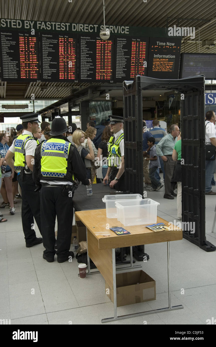 Metal detectors in use at croydon station hires stock photography and