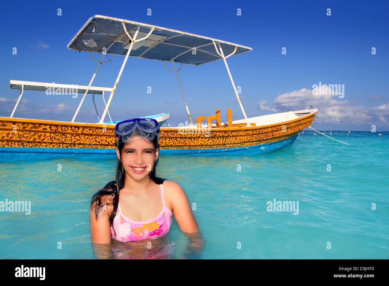 latin teen girl in Caribbean beach with goggles Stock Photo