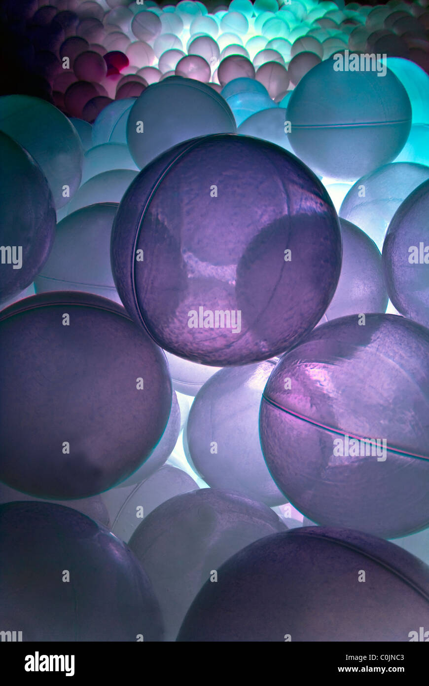 Ball pool with purple light in the light sensory room. Stock Photo