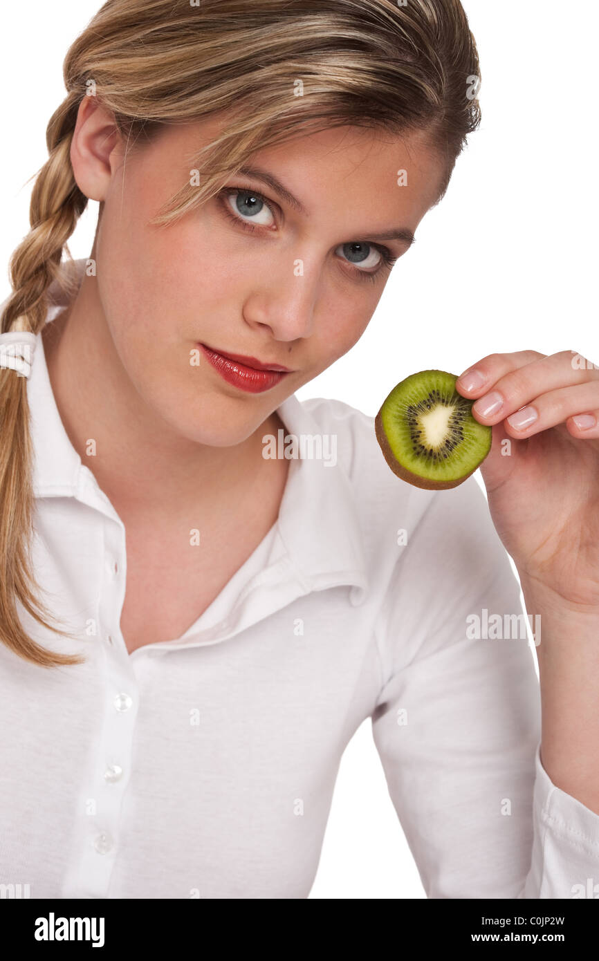 Woman holding slice of kiwi on white background Stock Photo - Alamy