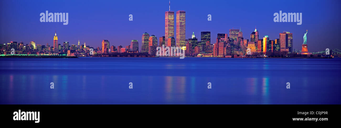 Panoramic New York City skyline at dusk with the World Trade Towers and ...