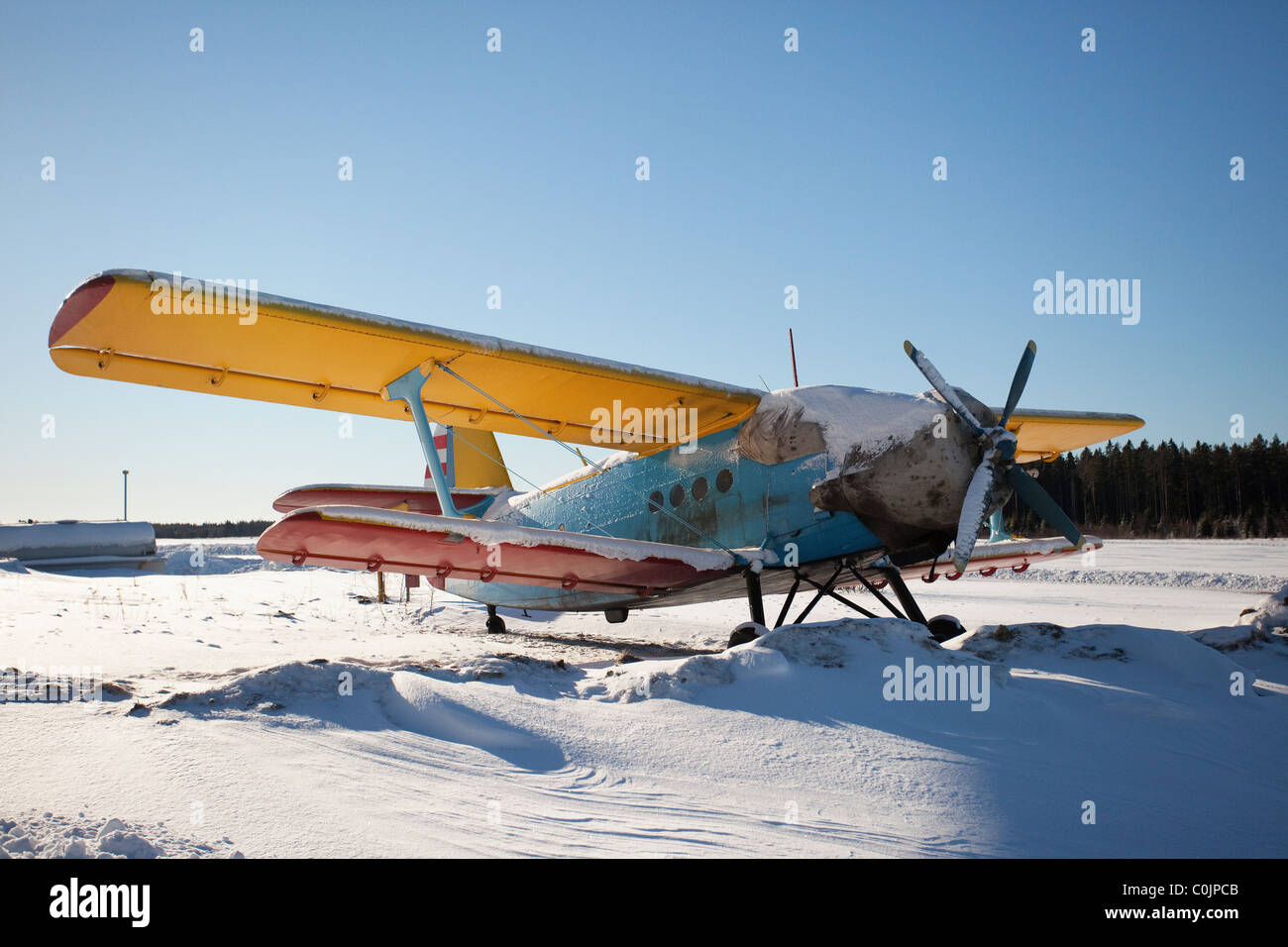 Old double-decker aeroplane standing in the snow Stock Photo